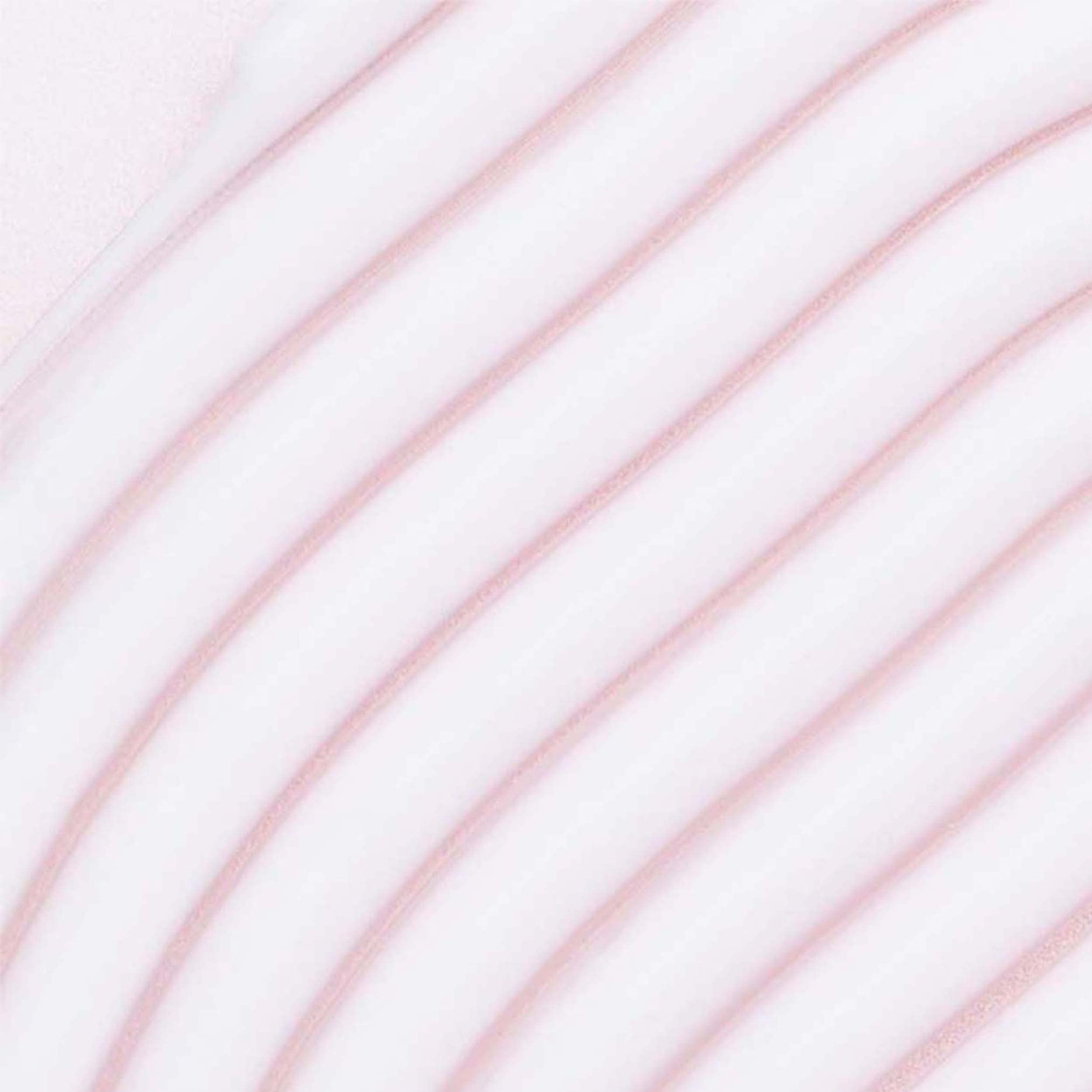 Umberto Giannini Crème Hydratante — application sur cheveux humides pour définir les boucles.