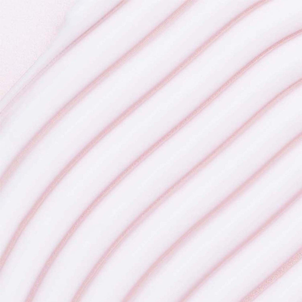 Umberto Giannini Crème Hydratante — application sur cheveux humides pour définir les boucles.