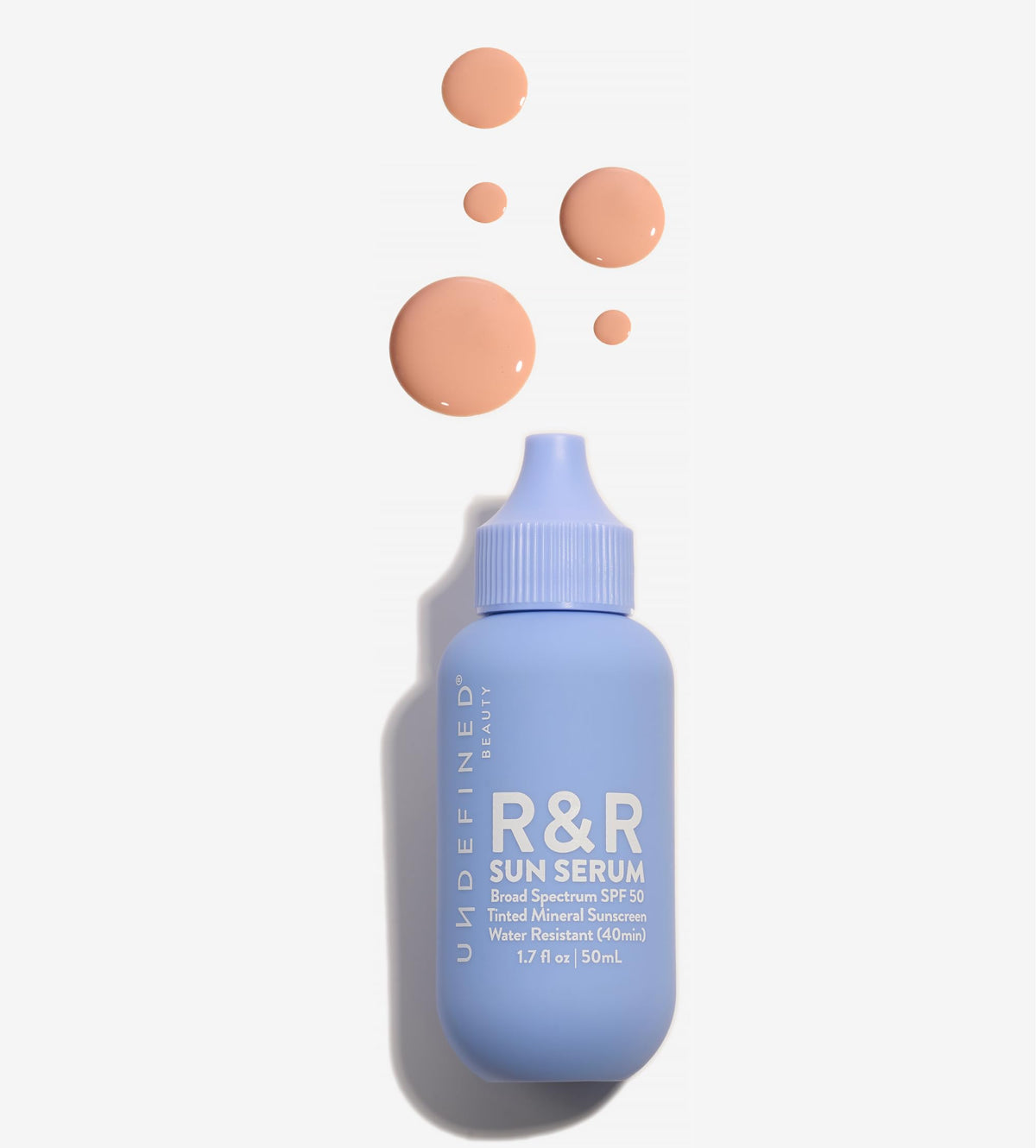 Undefined Beauty R&R Sun Serum SPF 50 teinte claire, protection minérale et fini naturel.