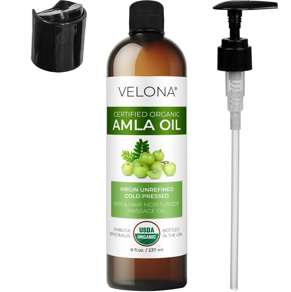 Velona Amla huile - application mains révèle douceur et soin des longueurs.