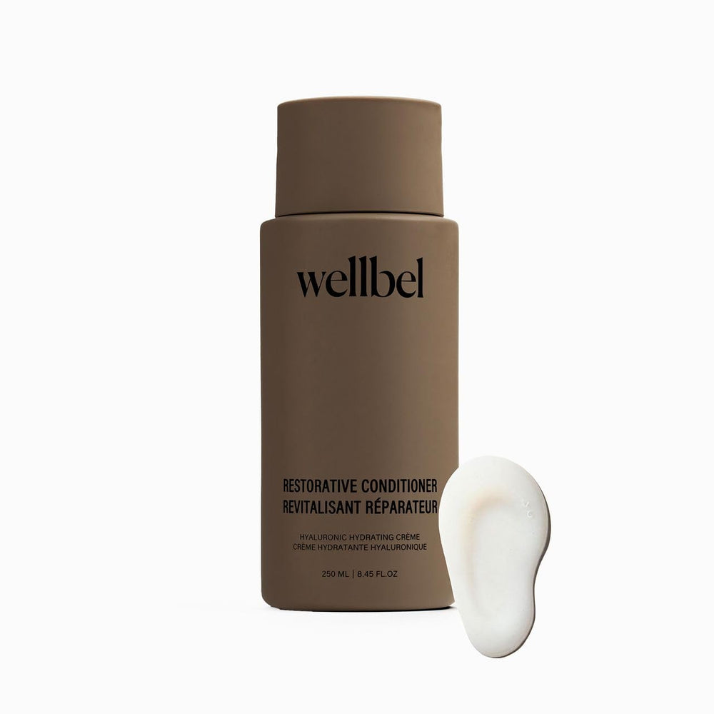 Bouteille WELLBEL Restoratif Conditionneur, design épuré, hydratation légère pour cheveux.