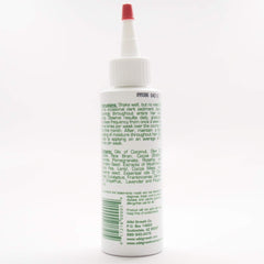Application mains: huile Wild Growth pour démêler et lisser les cheveux.