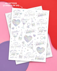 Tatouages xo-fetti iridescents avec bagues, parfait souvenir chic.