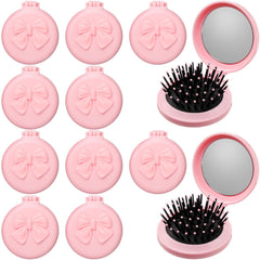 Brosse pliante Yiyiring rose avec miroir, pratique pour sac à main ou voyage.