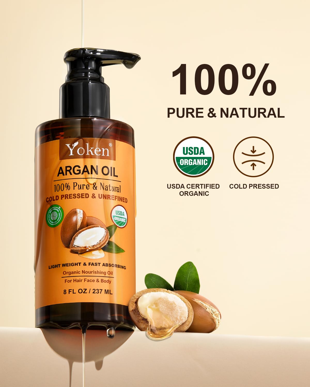 Goutte d'huile argan Yoken sur cheveux pour une brillance naturelle.