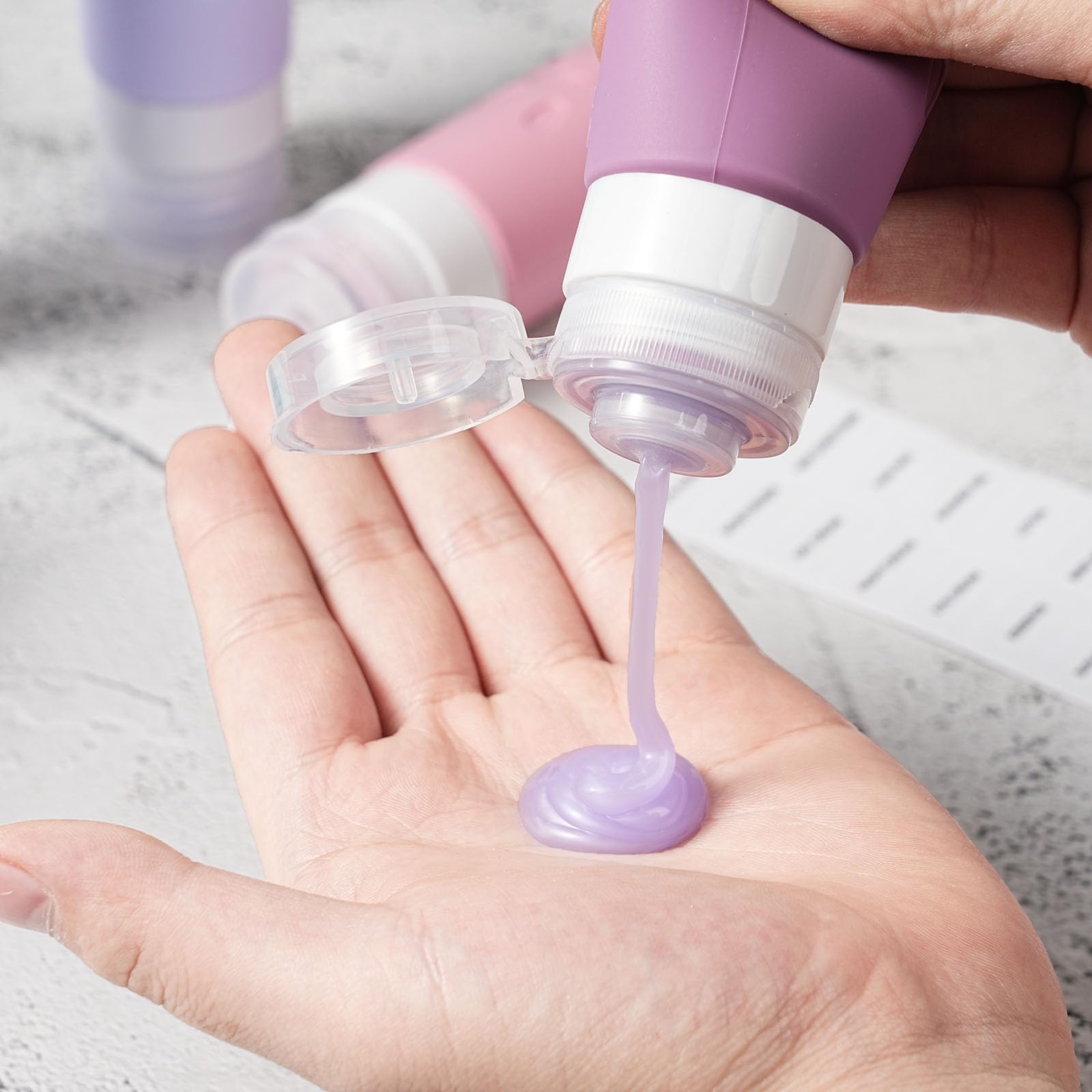 Bouteilles Zafit polyvalentes pour shampoing, après-shampooing et lotion en déplacement.